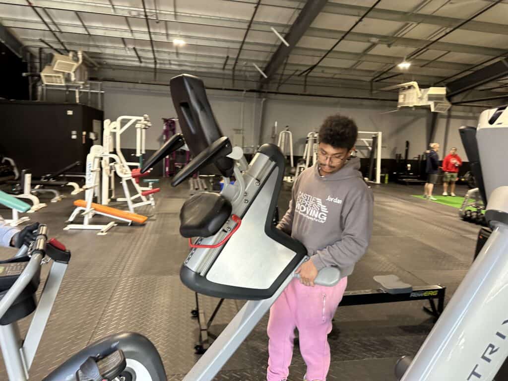 Jordan Carrying Gym Equipment