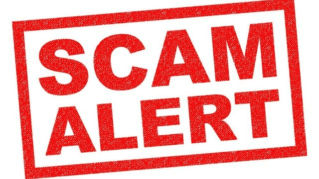 A huge sign of scam alert is depicted to give awareness to customers against moving company scams.