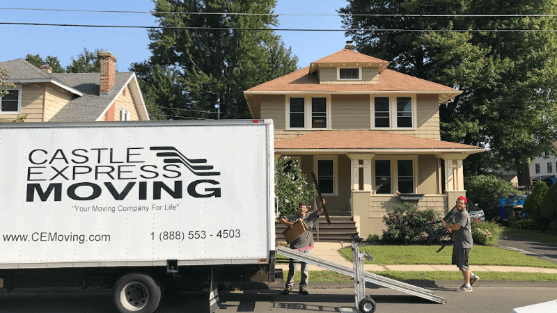 Castle Express professional movers are carefully loading a client's belongings for their local move.